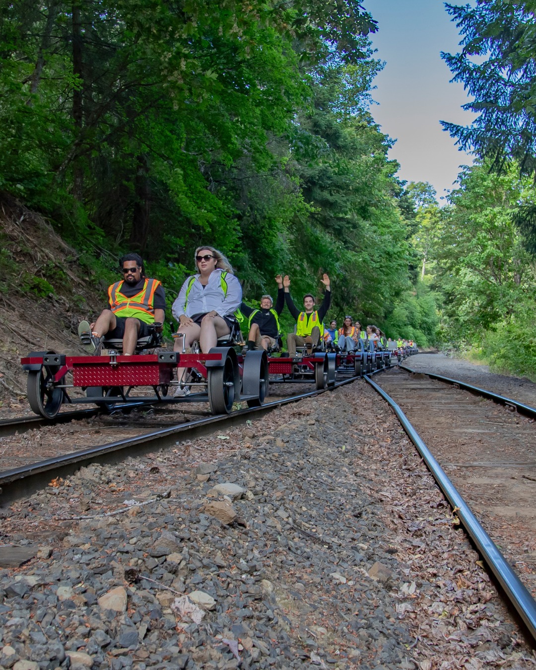 Guests ride pedal-assist rail bikes