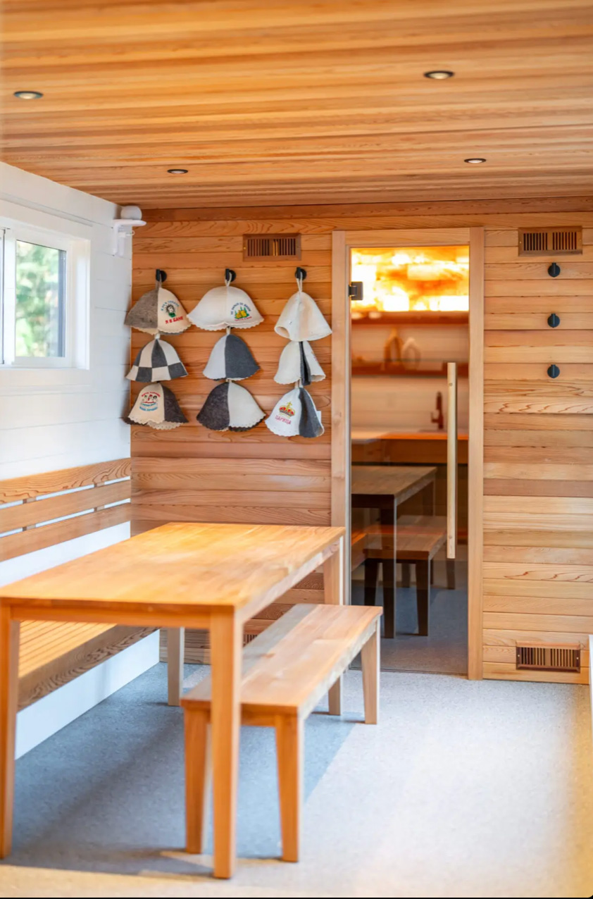 Sauna hats hang near the door to the NordicaHaus sauna