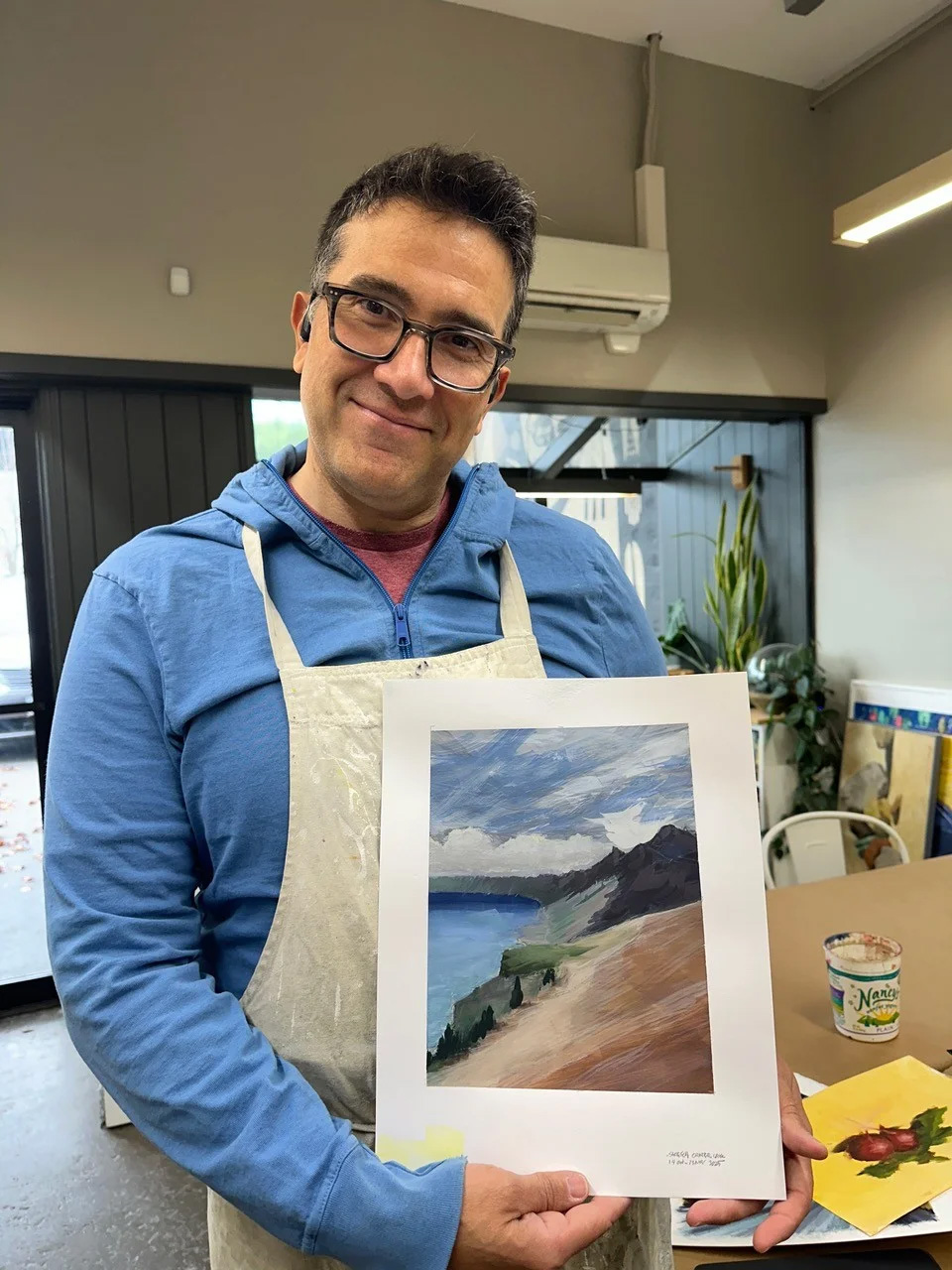 A student shows off their work at Tokkia Art Supply